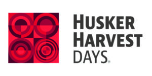 red square logo "Husker Harvest Days"